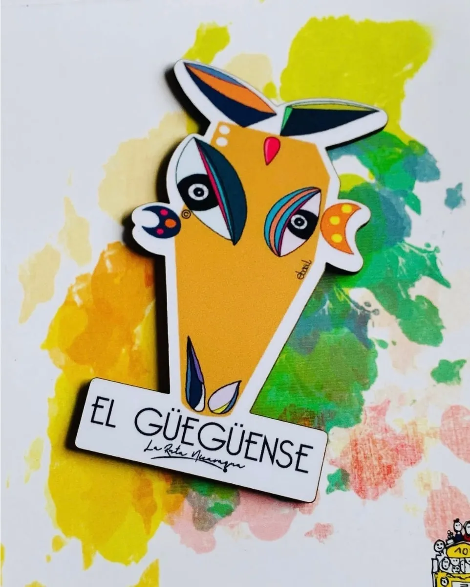 A magnet of El Güegüense, the folk theatre mask, in yellow and blue